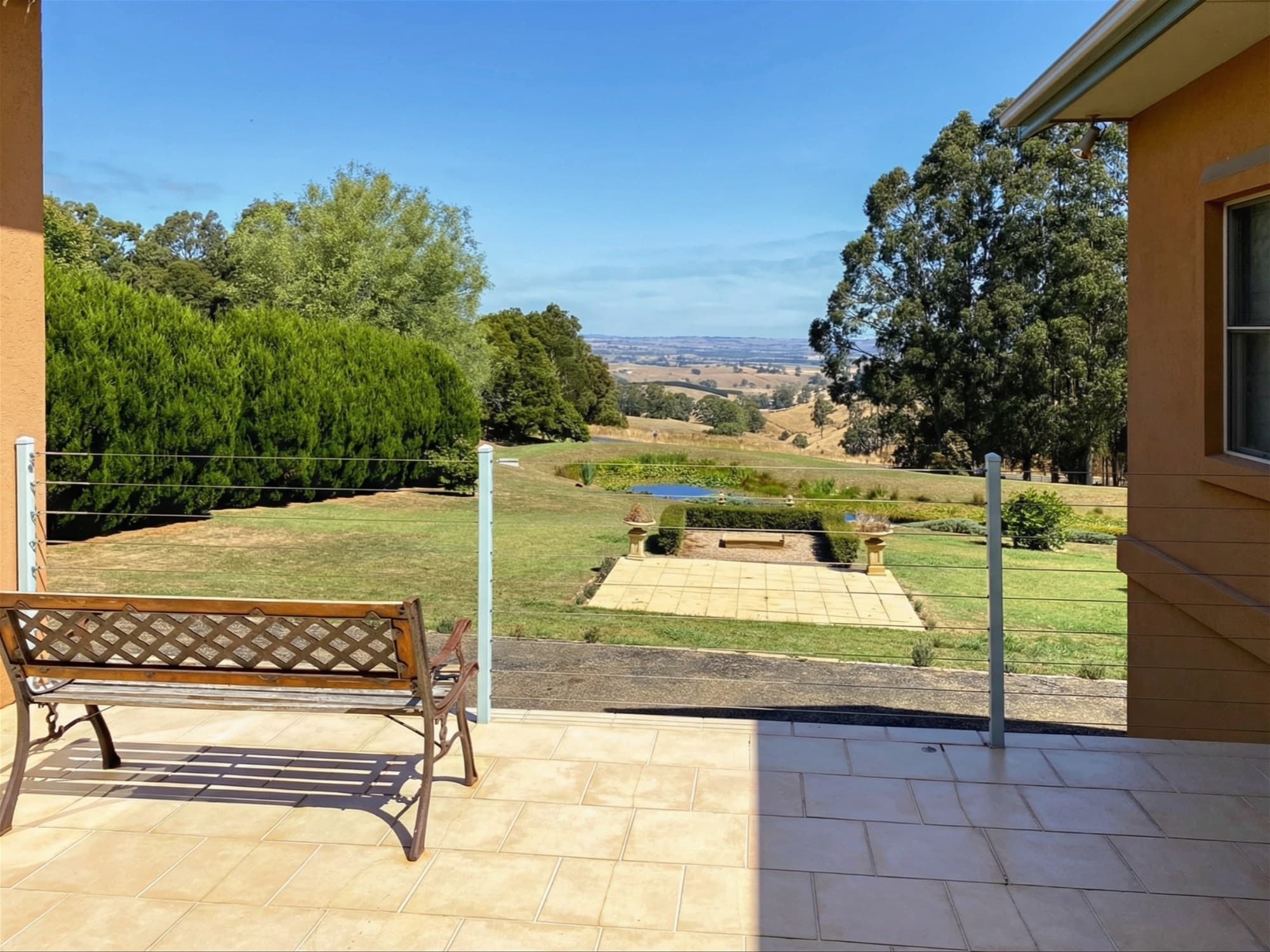 Terrace and valley view at the active Mardan listing used as an inland comparison against Inverloch